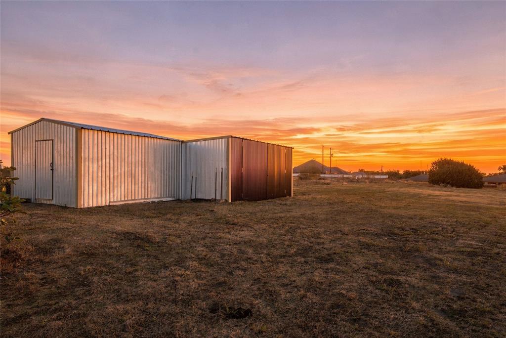 560 Green Acres Road Weatherford, TX 76088 - Photo 6 of 35 20 x 20 Shop Metal-sided outbuilding with multiple sections and a sloped roof