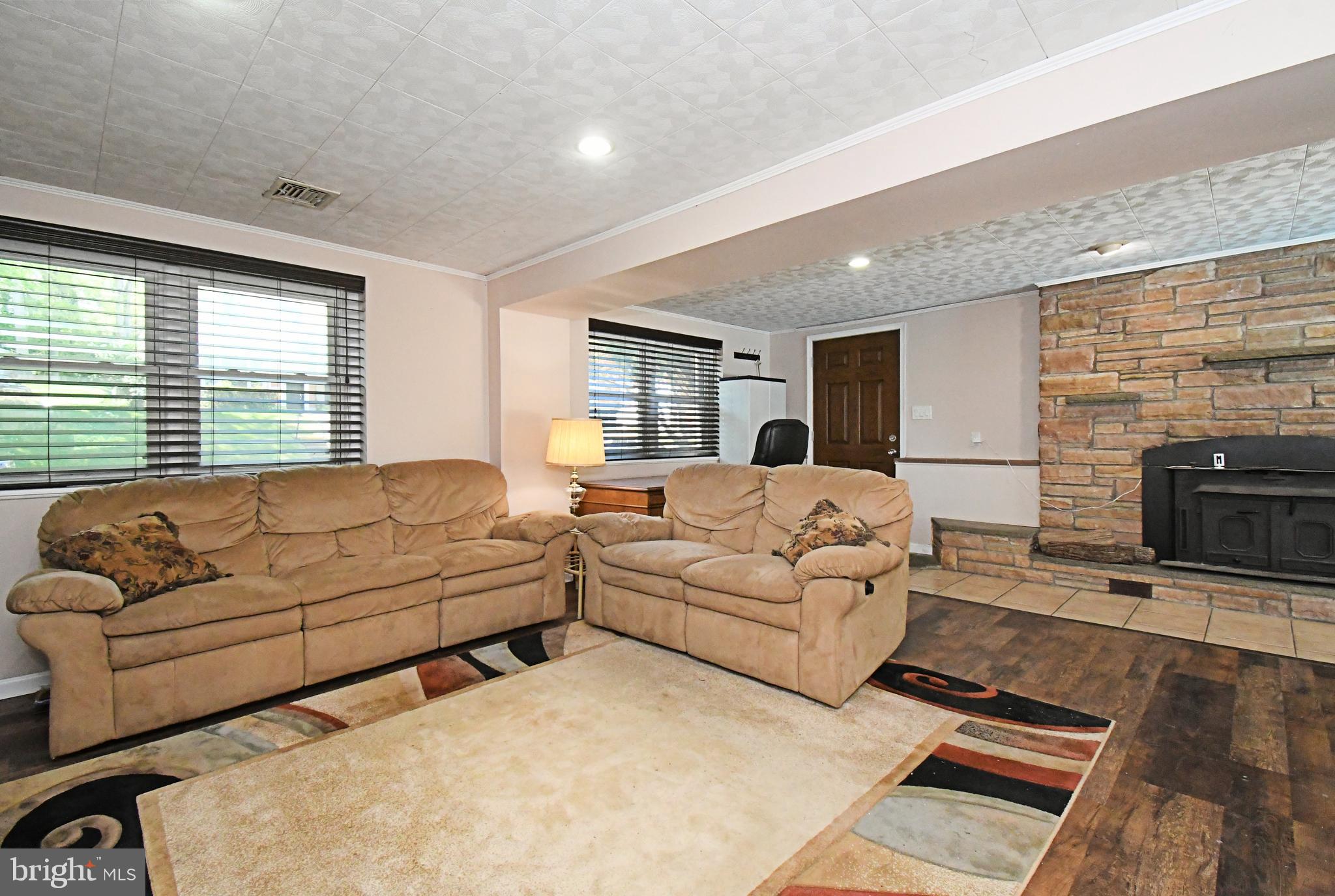609 Mansfield Road Willow Grove, PA 19090 - Photo 33 of 68 a living room with furniture window and a fireplace