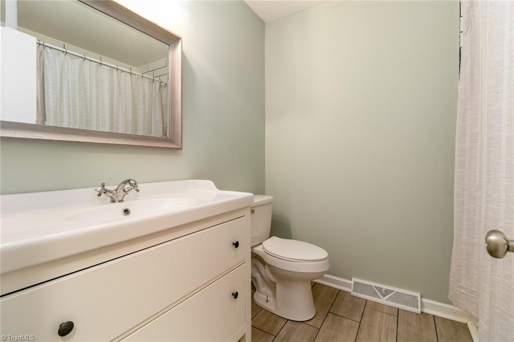 2210 Waynick Street High Point, NC 27265 - Photo 17 of 28 Full upstairs bathroom with tub/shower.