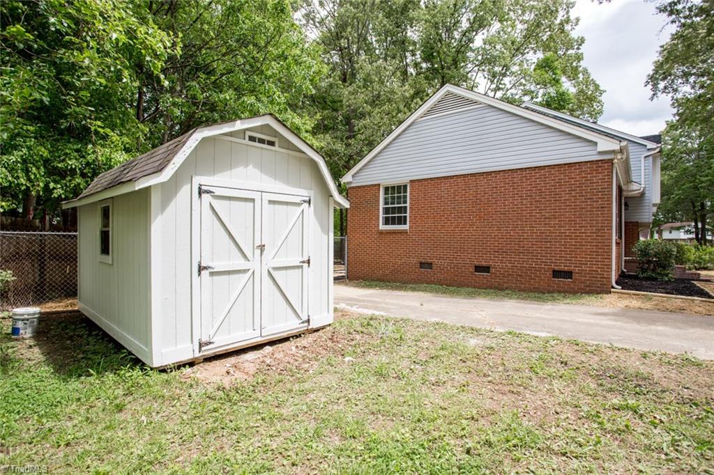 2210 Waynick Street High Point, NC 27265 - Photo 27 of 28 Driveway and storage shed