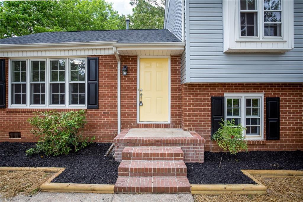 2210 Waynick Street High Point, NC 27265 - Photo 4 of 28 Freshly painted door, newly mulched beds.