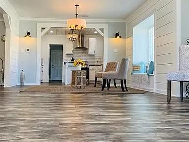 602 South Chestnut Street McKinney, TX 75069 - Photo 4 of 24 a view of kitchen with furniture and wooden floor