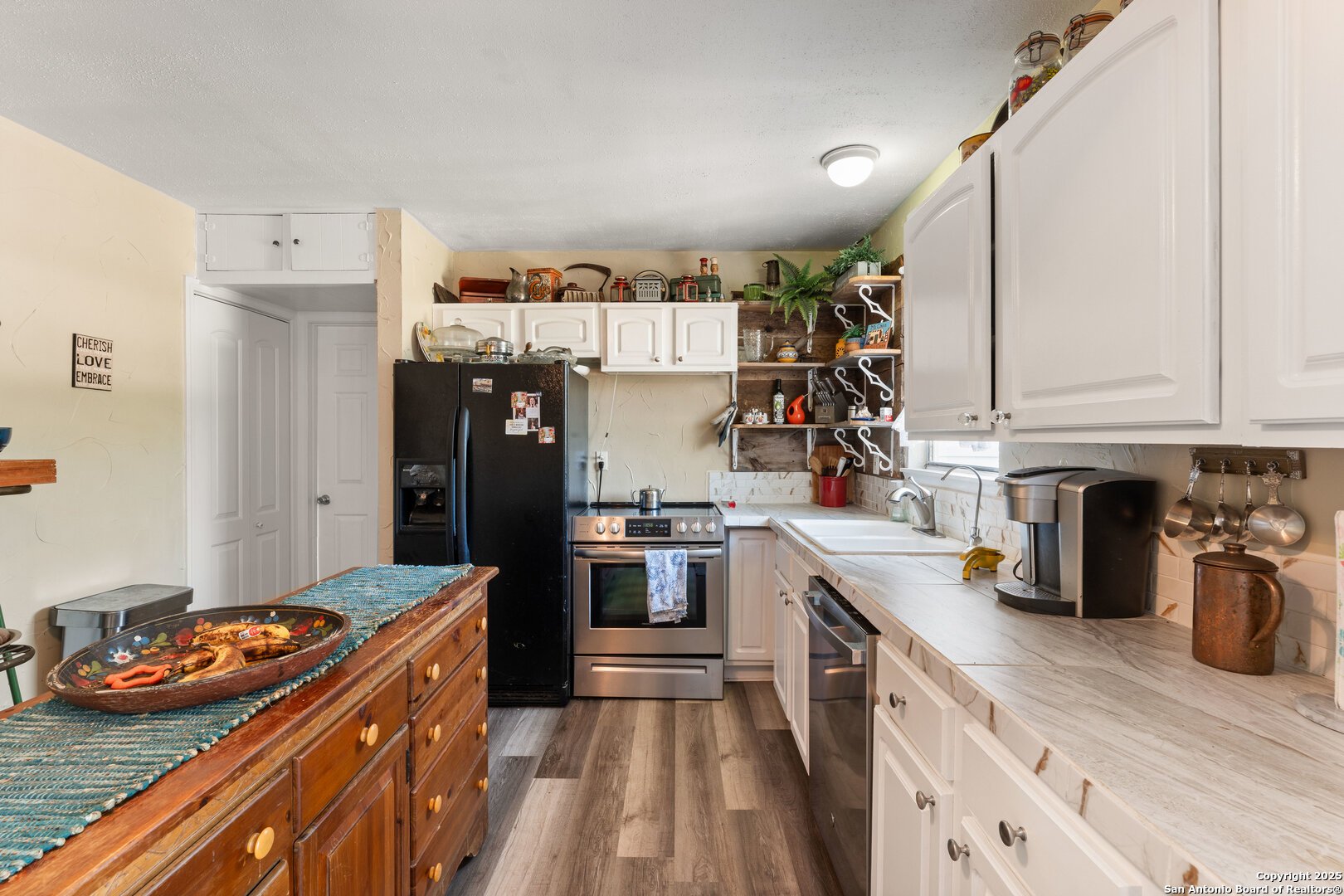 1843 Rhinestone Canyon Lake, TX 78133 - Photo 11 of 39 a kitchen with stainless steel appliances granite countertop a refrigerator and stove