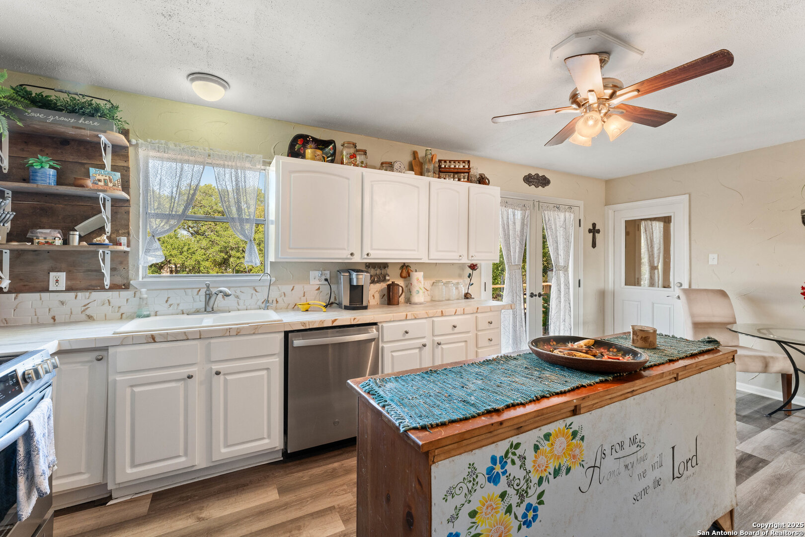 1843 Rhinestone Canyon Lake, TX 78133 - Photo 13 of 39 a kitchen with a stove a sink and a refrigerator