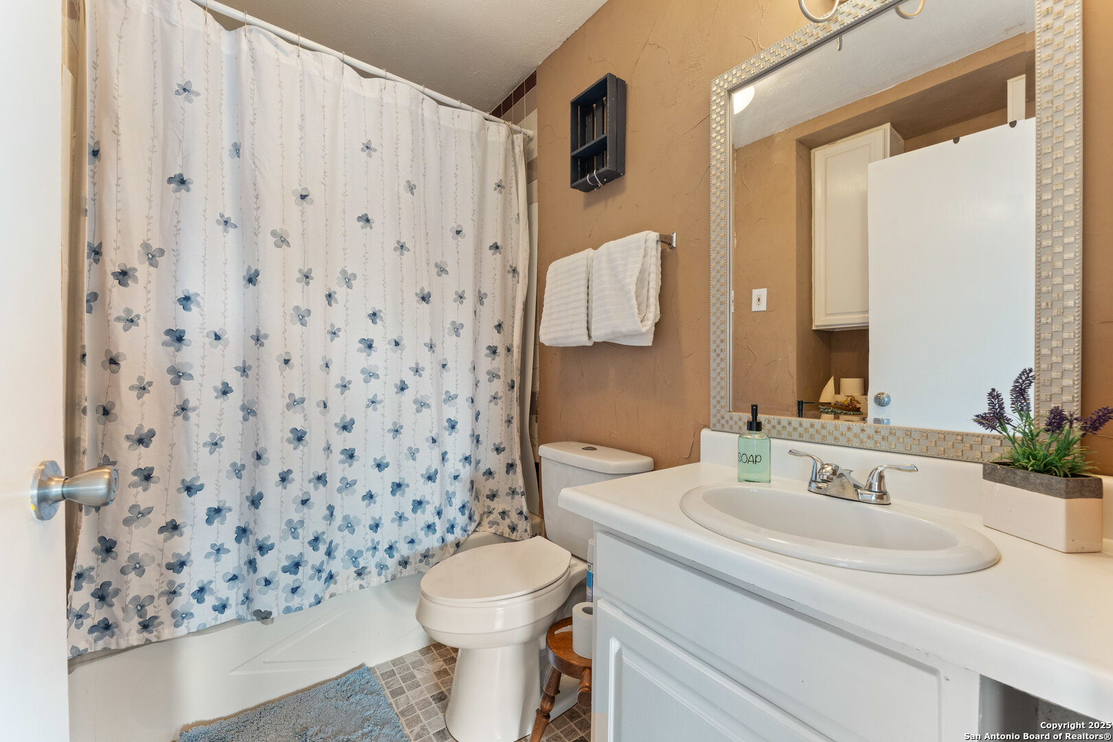 1843 Rhinestone Canyon Lake, TX 78133 - Photo 17 of 39 a bathroom with a sink toilet and shower