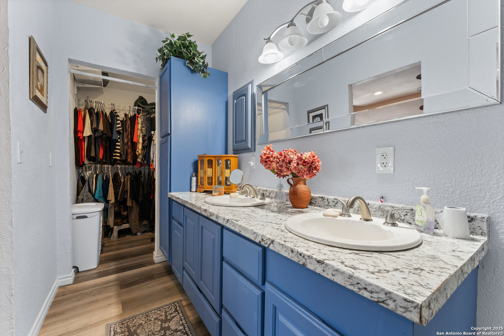 1843 Rhinestone Canyon Lake, TX 78133 - Photo 29 of 39 a bathroom with a granite countertop sink a large mirror and a shower