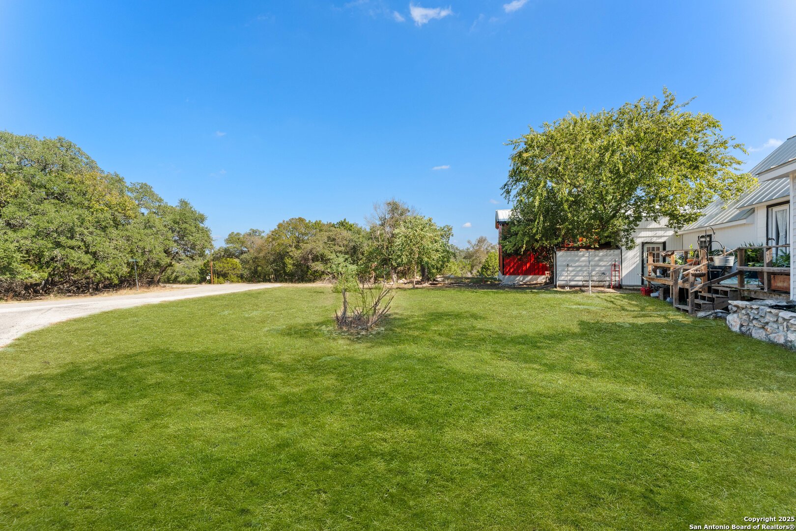 1843 Rhinestone Canyon Lake, TX 78133 - Photo 34 of 39 a view of yard with swimming pool and green space