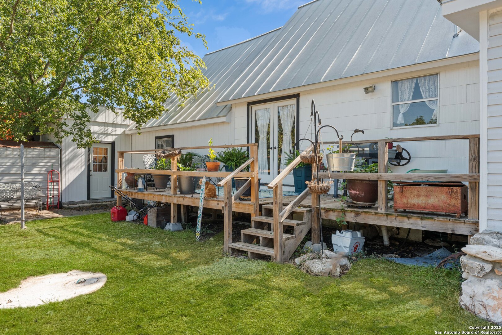 1843 Rhinestone Canyon Lake, TX 78133 - Photo 38 of 39 a view of a house with a backyard and sitting area