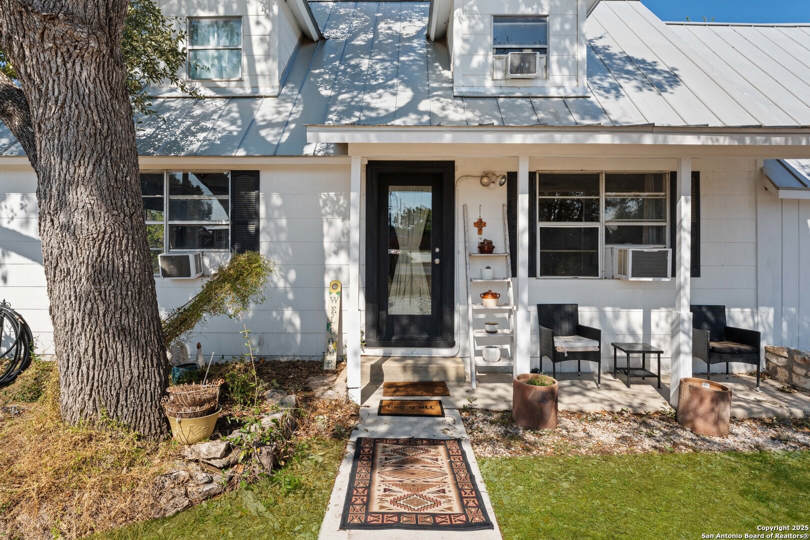 1843 Rhinestone Canyon Lake, TX 78133 - Photo 4 of 39 a front view of a house with a porch