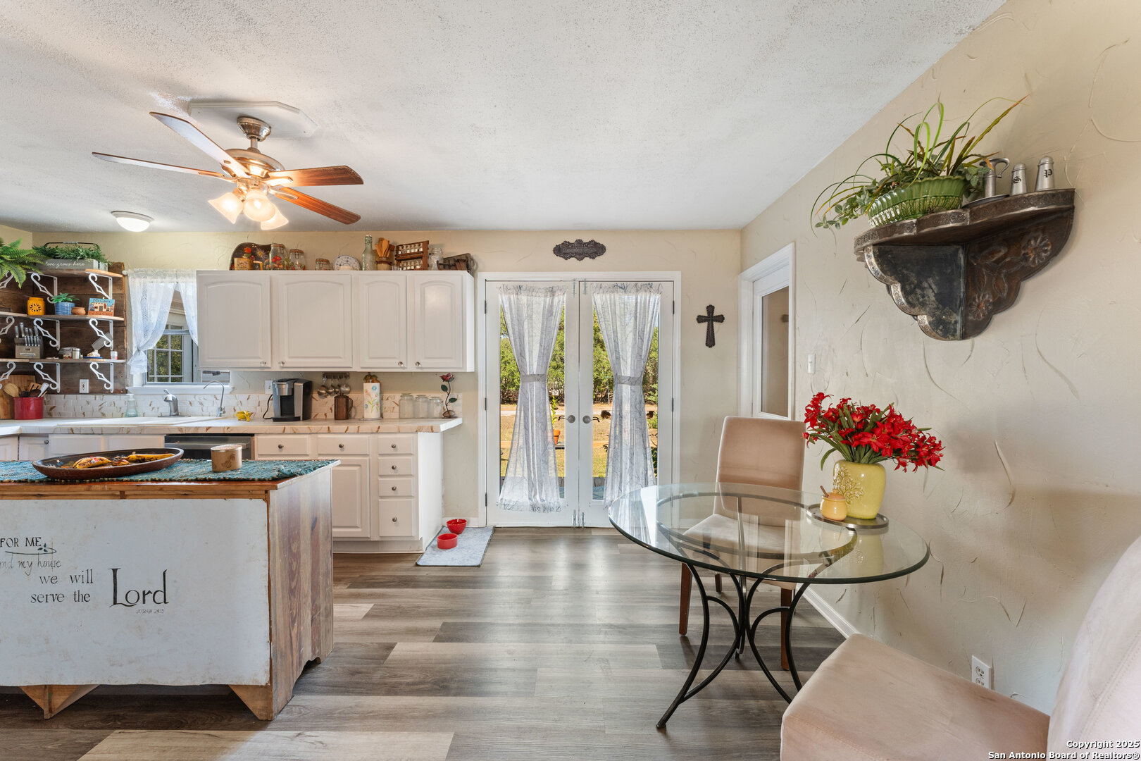 1843 Rhinestone Canyon Lake, TX 78133 - Photo 8 of 39 a living room with furniture and a chandelier