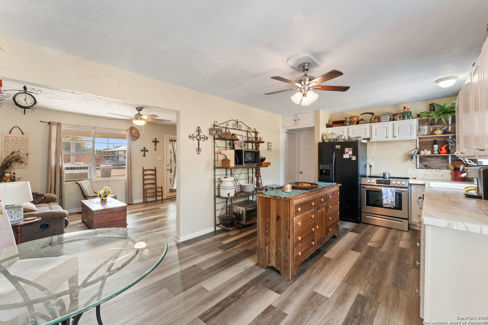 1843 Rhinestone Canyon Lake, TX 78133 - Photo 9 of 39 a large kitchen with stainless steel appliances kitchen island granite countertop a stove refrigerator and cabinets