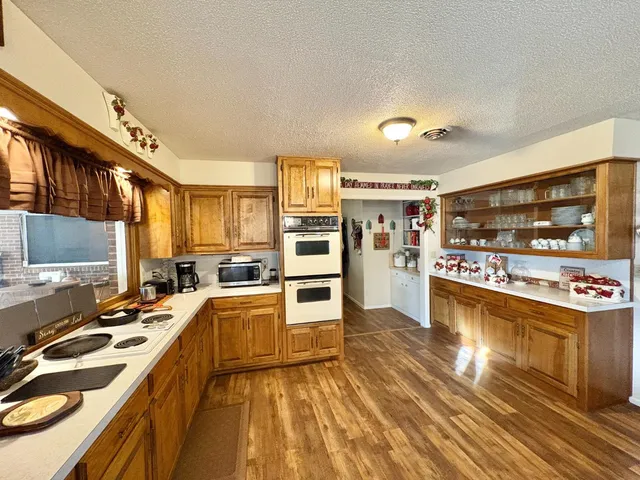 a kitchen with stainless steel appliances granite countertop a stove oven and a refrigerator