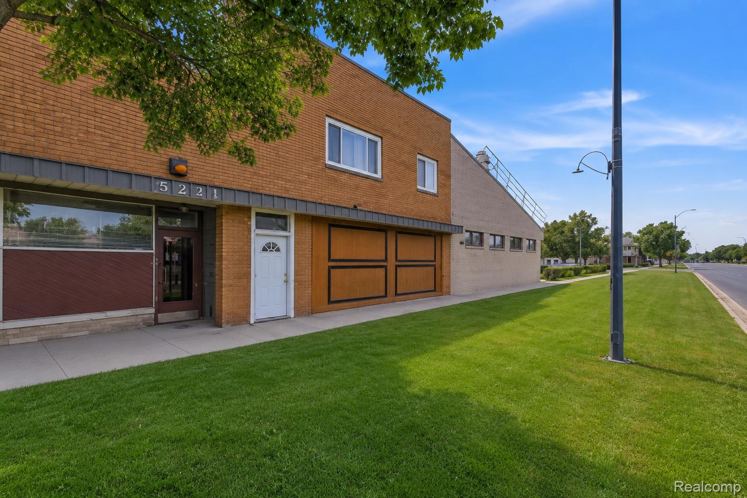 5223 Allen Road Allen Park, MI 48101 - Photo 2 of 12 Brick facade building featuring multiple entryways and a prominent street number display