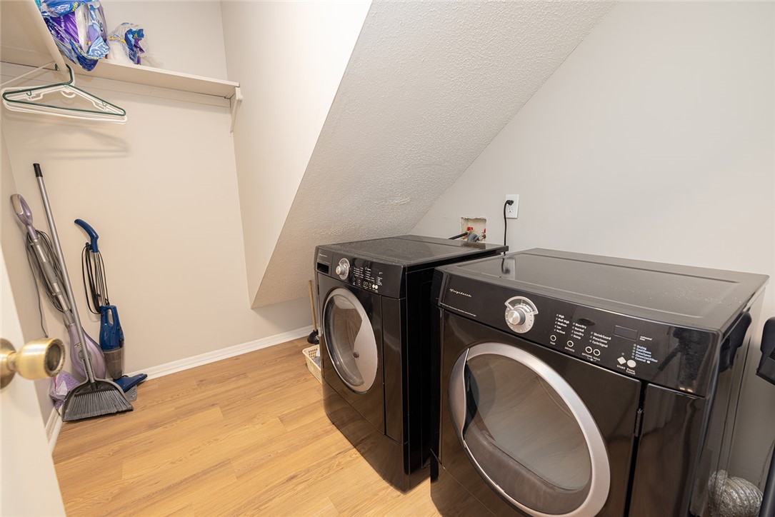 410 South Cove Road Seneca, SC 29672 - Photo 16 of 25 Functional laundry space featuring modern appliances, durable flooring, and convenient storage solutions for everyday tasks.