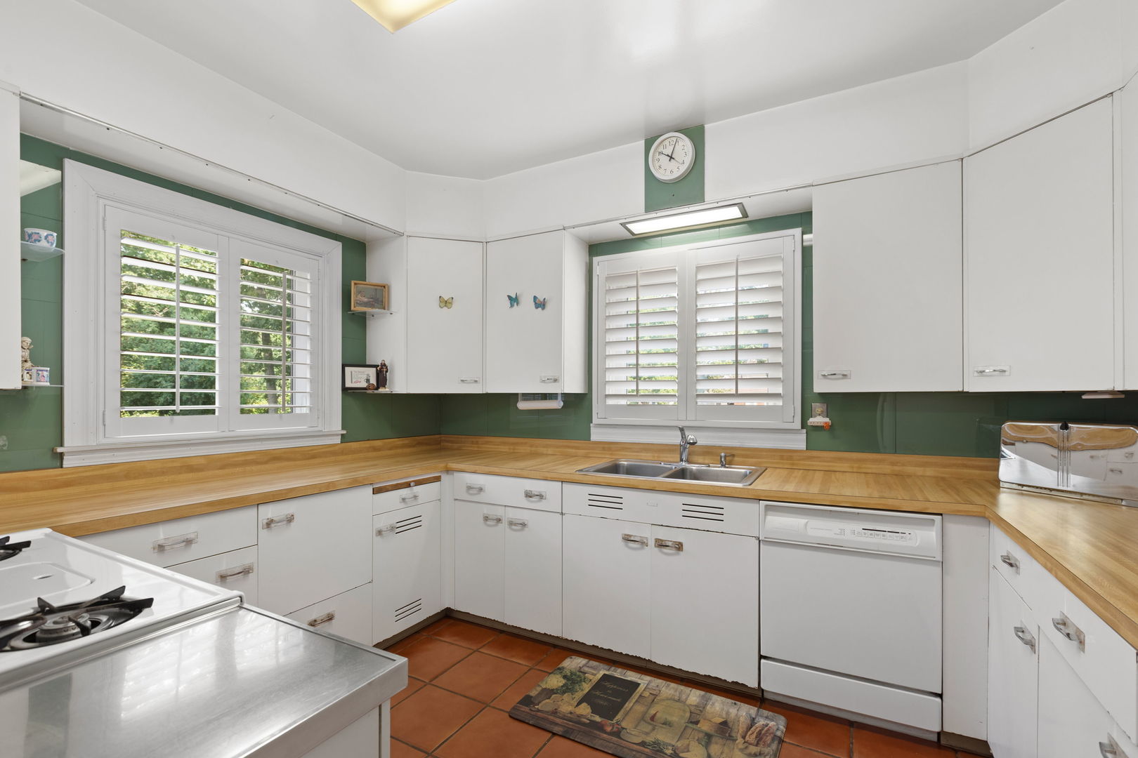 1011 Central Road Glenview, IL 60025 - Photo 13 of 36 a kitchen that has a sink and a stove