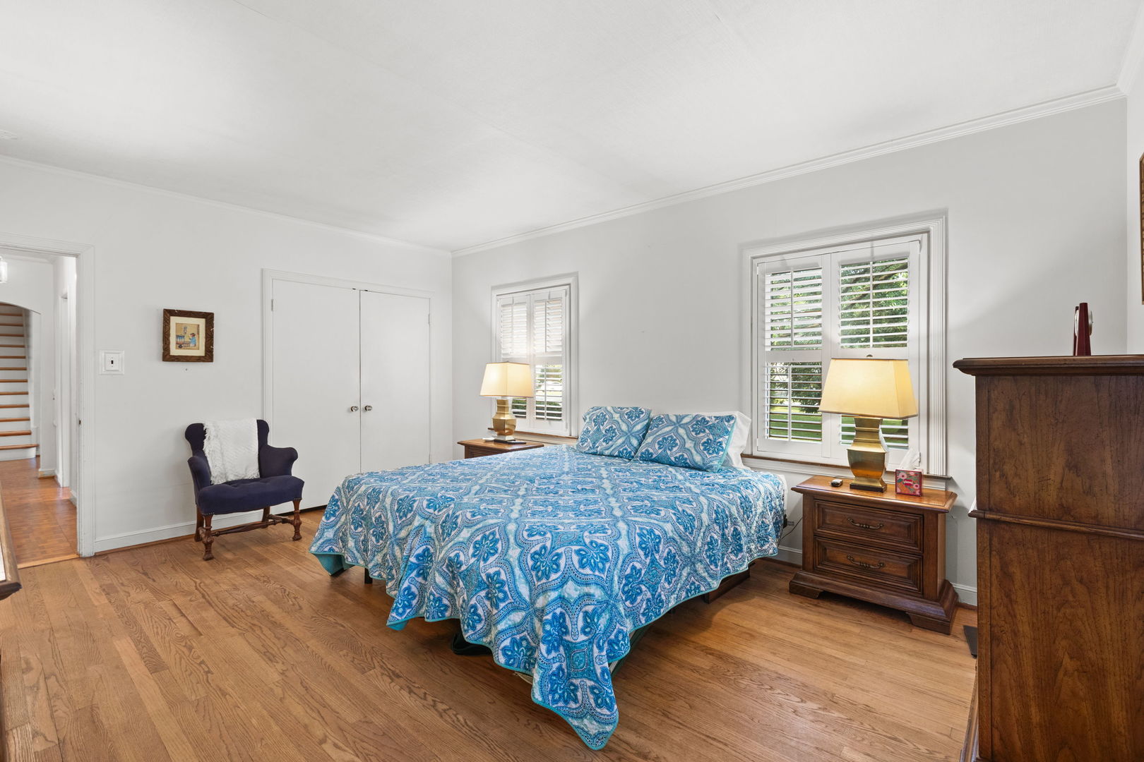 1011 Central Road Glenview, IL 60025 - Photo 16 of 36 a bedroom with a bed and wooden floor