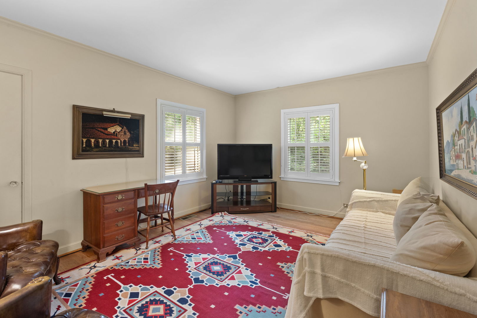 1011 Central Road Glenview, IL 60025 - Photo 17 of 36 a bedroom with furniture and a flat screen tv