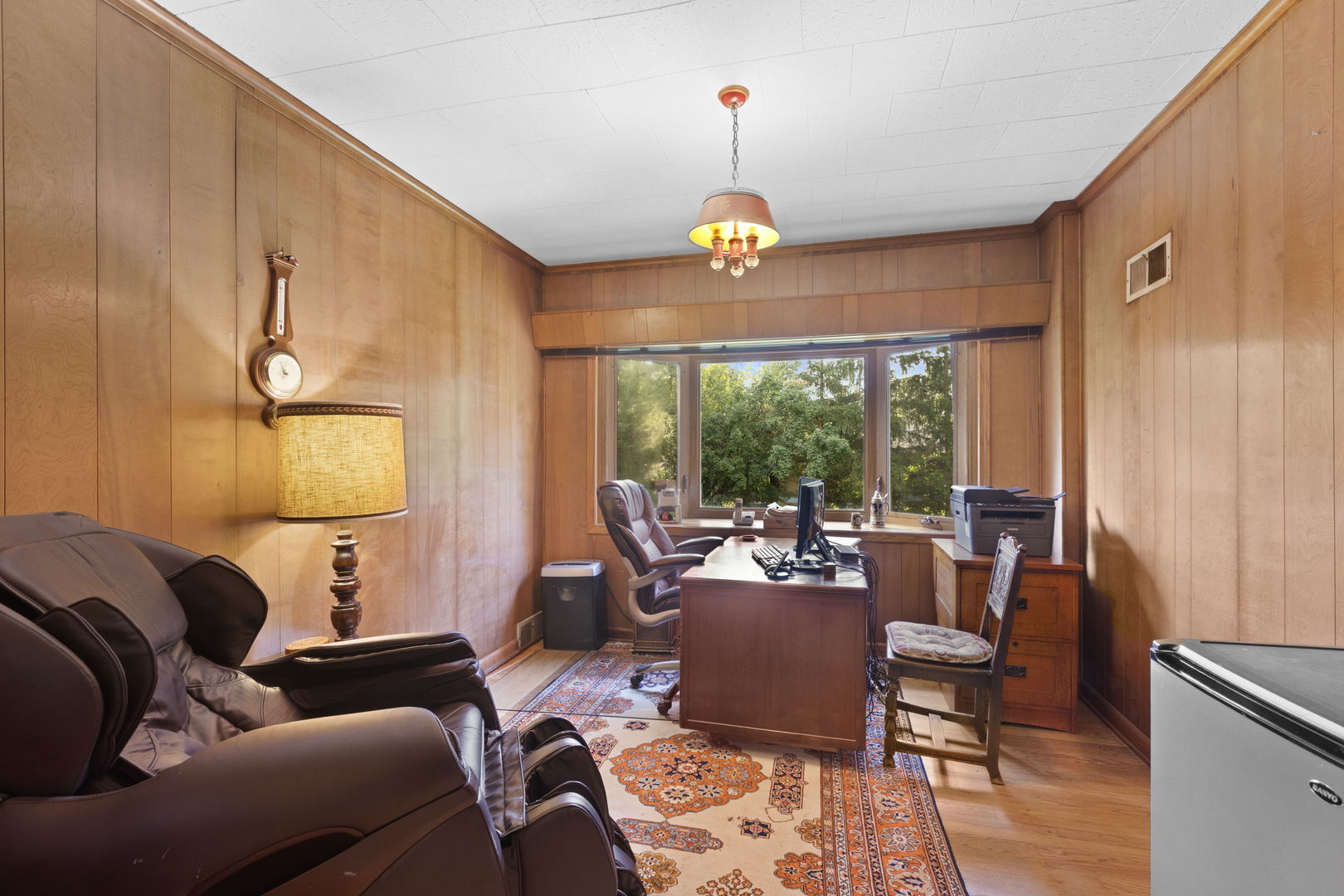 1011 Central Road Glenview, IL 60025 - Photo 18 of 36 a living room with furniture ceiling fan and a window