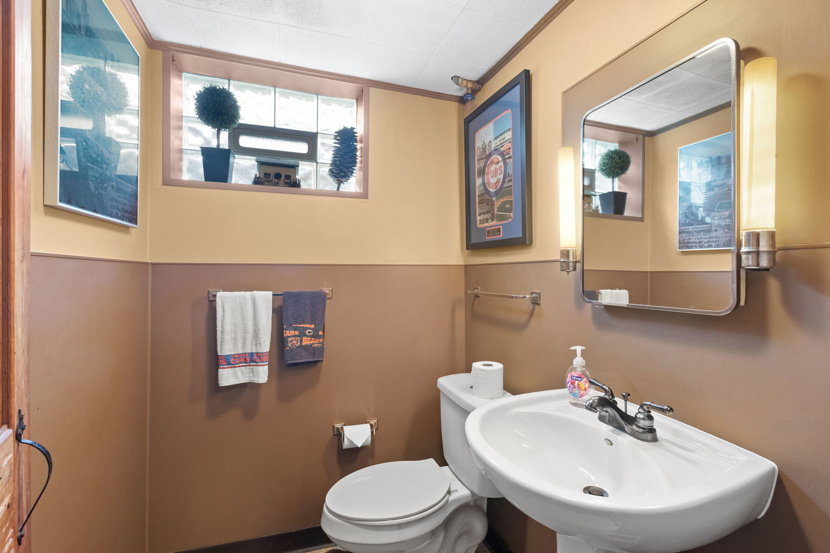 1011 Central Road Glenview, IL 60025 - Photo 29 of 36 a bathroom with a toilet a sink and mirror