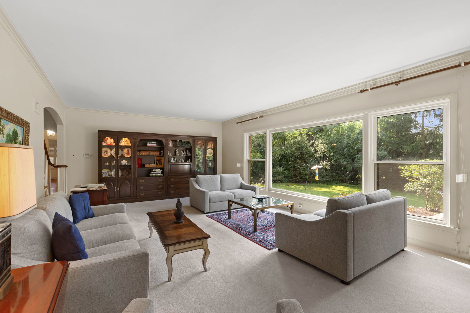 1011 Central Road Glenview, IL 60025 - Photo 8 of 36 a living room with furniture and a large window