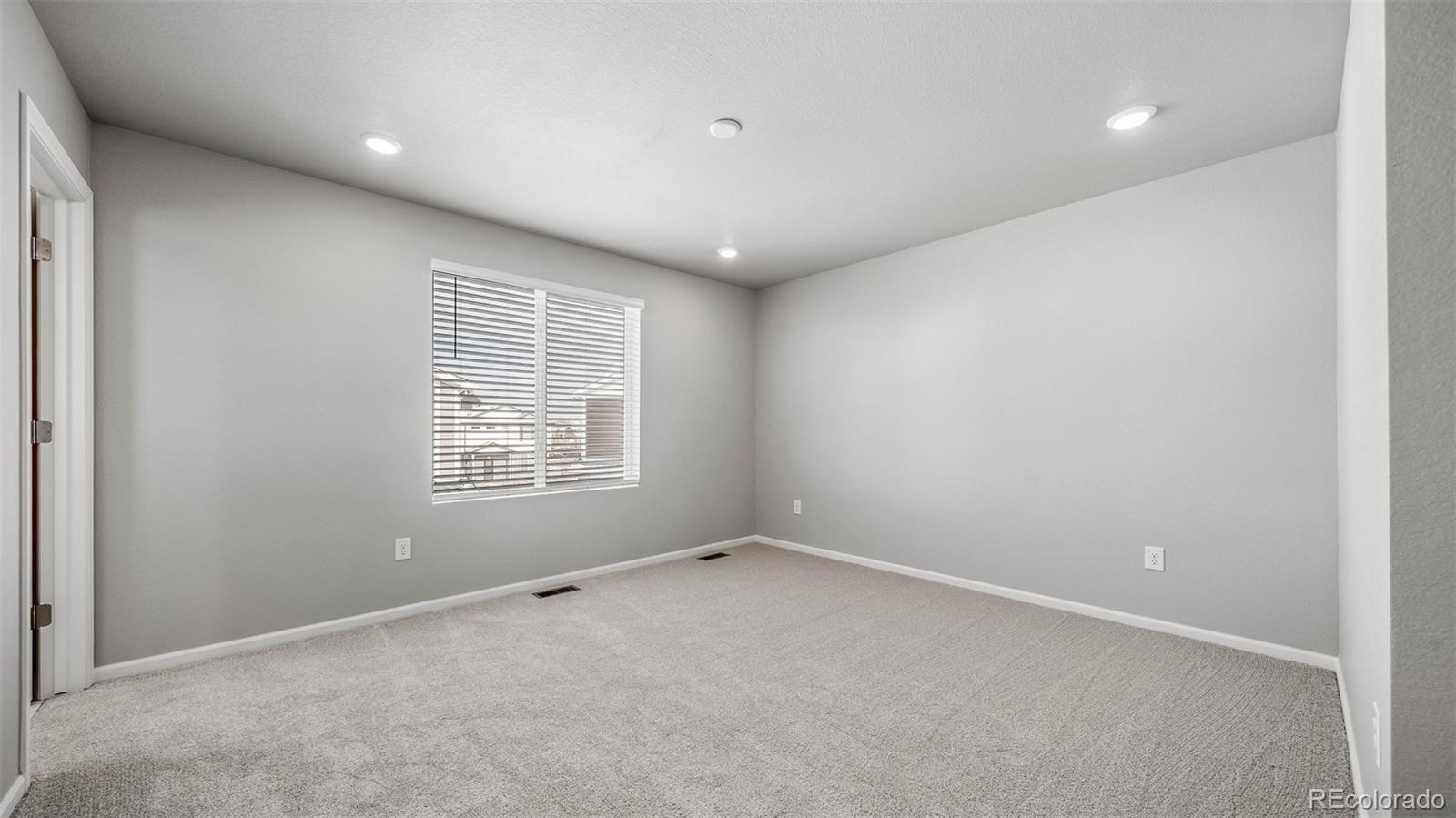 3970 North Rome Street Aurora, CO 80019 - Photo 12 of 22 an empty room with a window