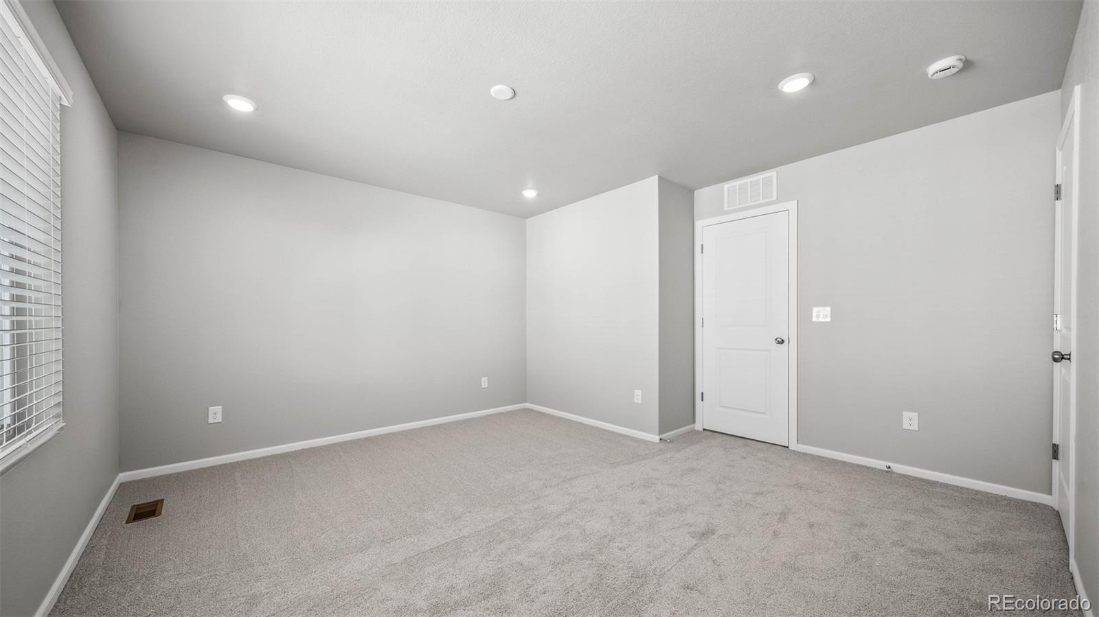 3970 North Rome Street Aurora, CO 80019 - Photo 13 of 22 an empty room with a empty space and windows