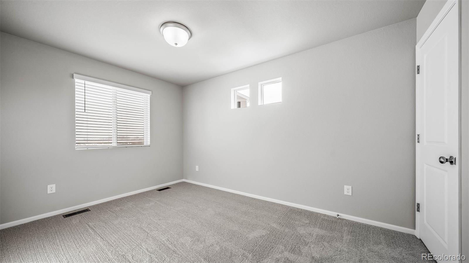 3970 North Rome Street Aurora, CO 80019 - Photo 17 of 22 an empty room with a window