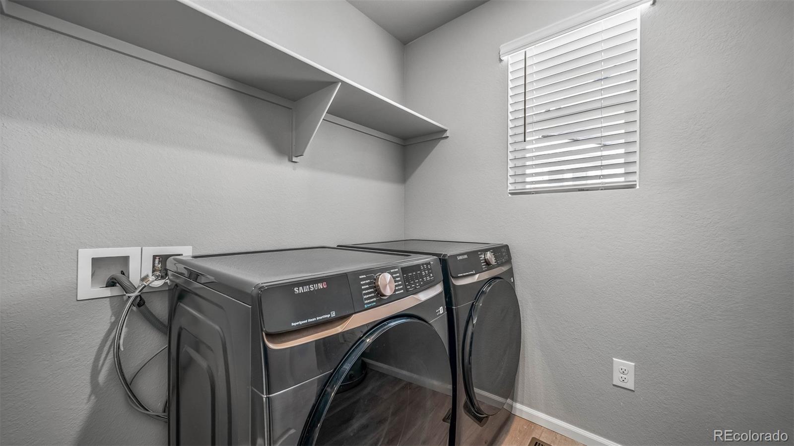 3970 North Rome Street Aurora, CO 80019 - Photo 20 of 22 a utility room with dryer and washer