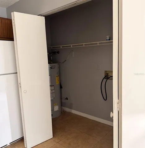 a kitchen with stainless steel appliances a sink and a refrigerator
