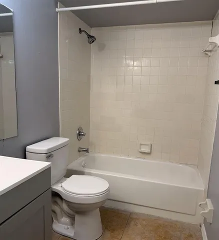 a bathroom with a toilet a sink and a bathtub