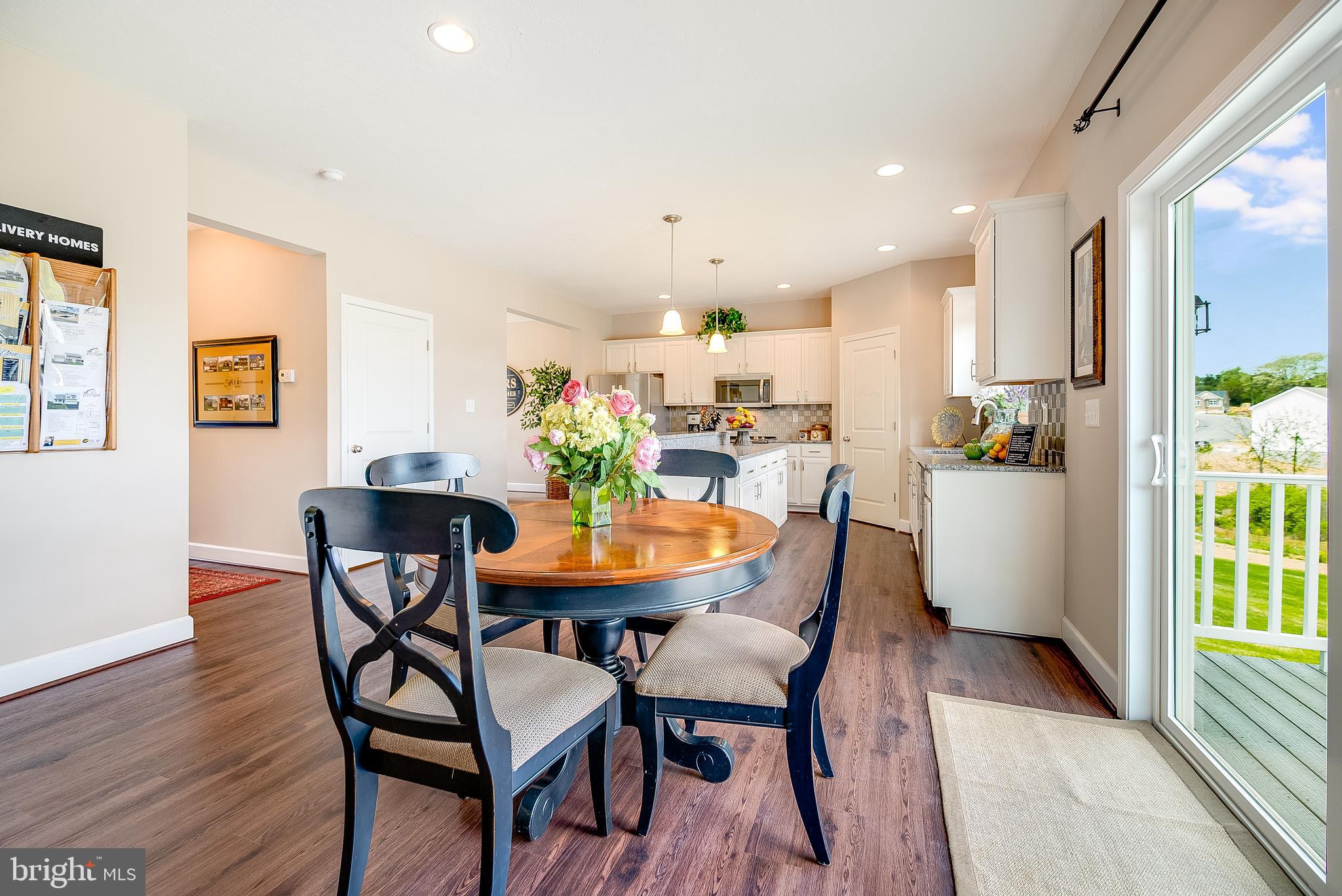 102 Piedmont Way, Unit 139 Hanover, PA 17331 - Photo 11 of 27 a view of a dining room with furniture and a potted plant