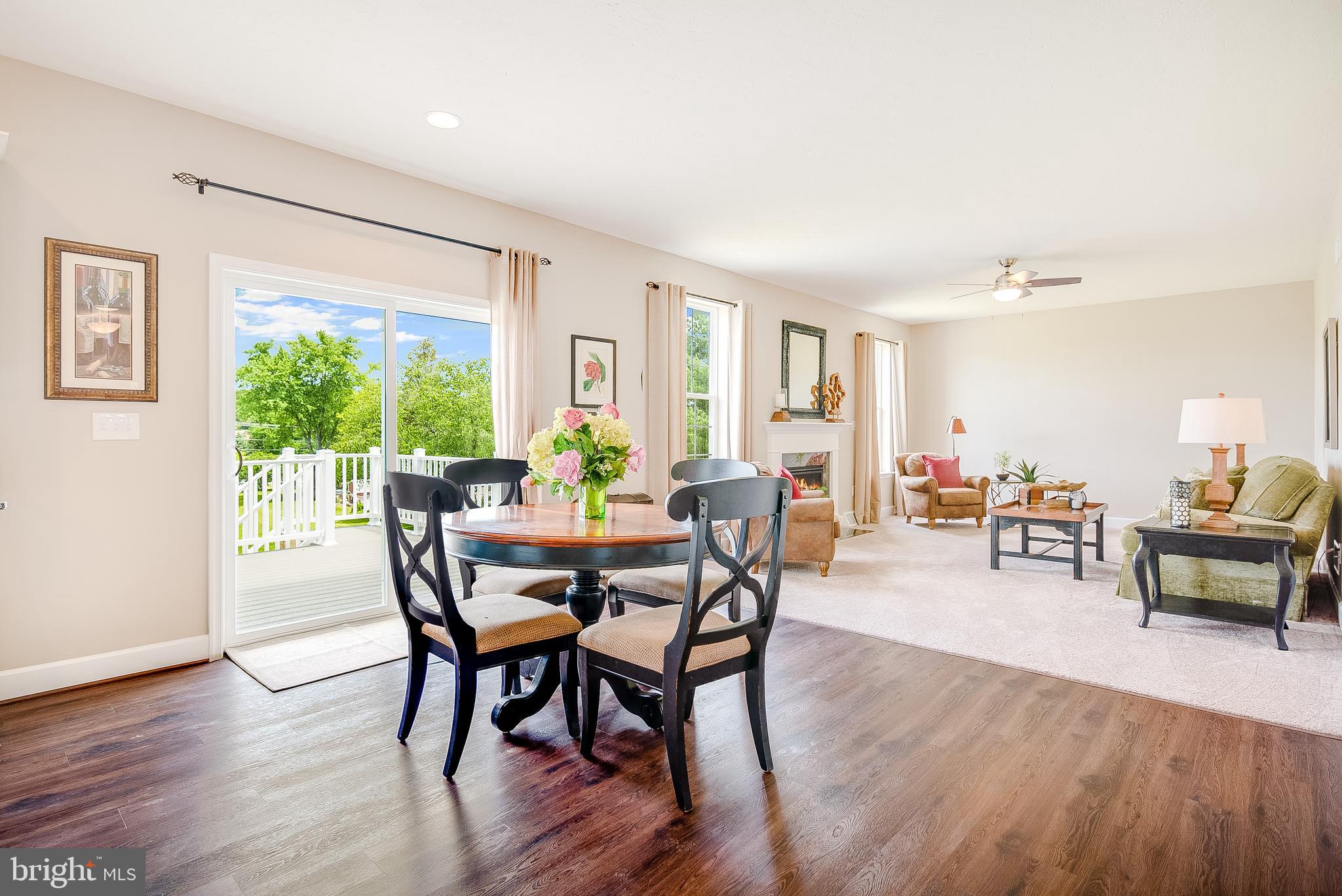 102 Piedmont Way, Unit 139 Hanover, PA 17331 - Photo 12 of 27 a view of a dining room with furniture and wooden floor