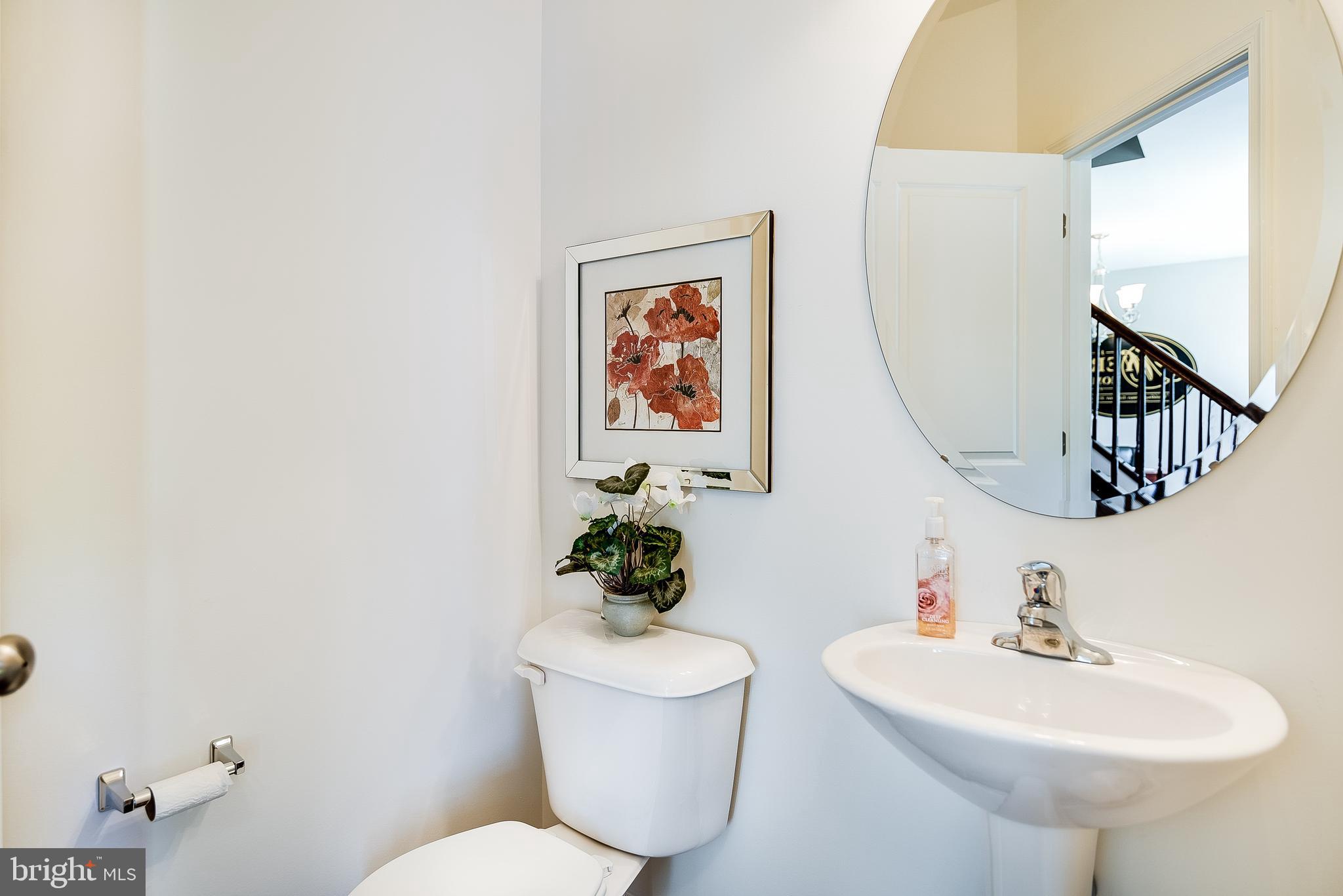 102 Piedmont Way, Unit 139 Hanover, PA 17331 - Photo 15 of 27 a bathroom with a toilet sink and mirror