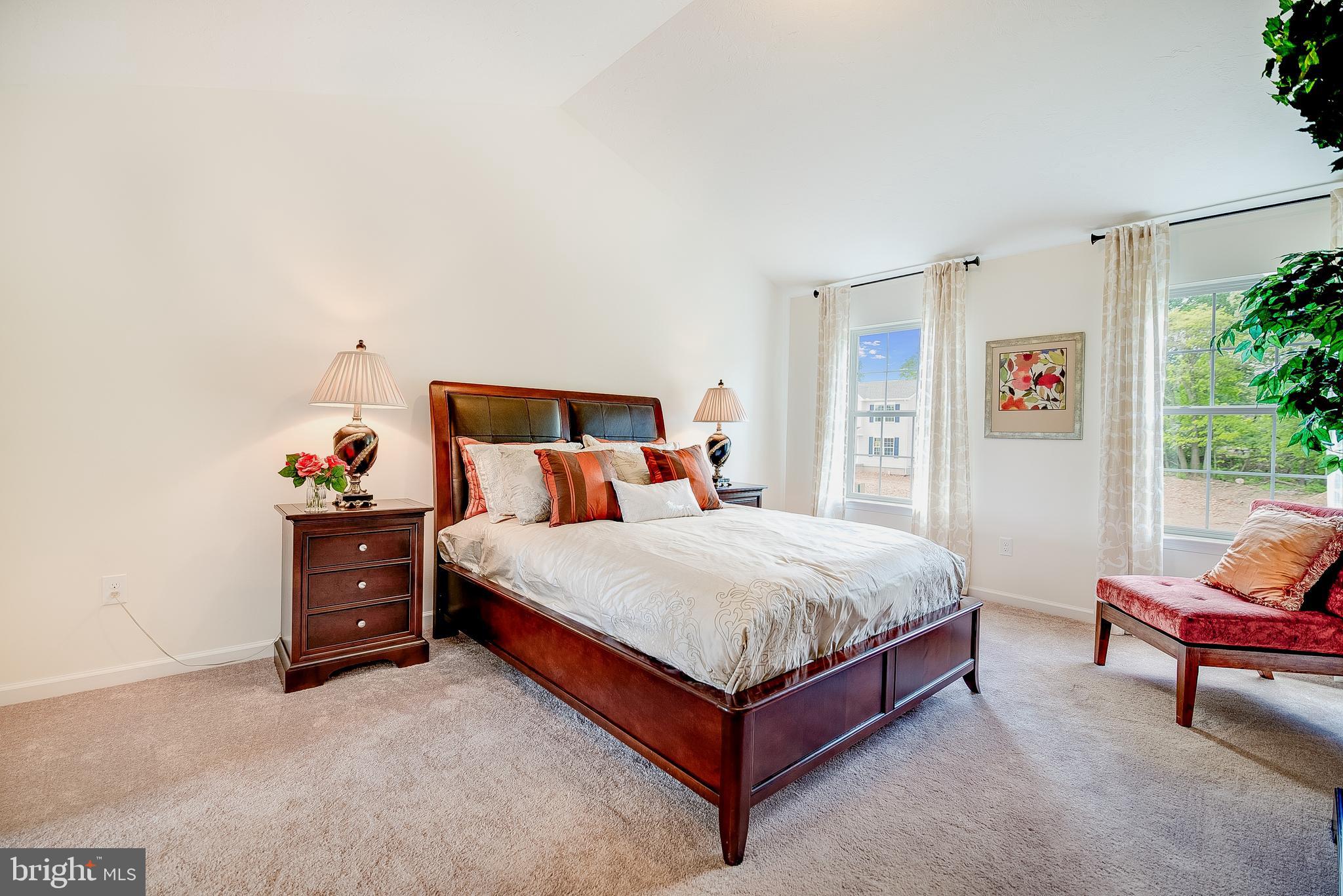 102 Piedmont Way, Unit 139 Hanover, PA 17331 - Photo 16 of 27 a bed room with a bed and a chair