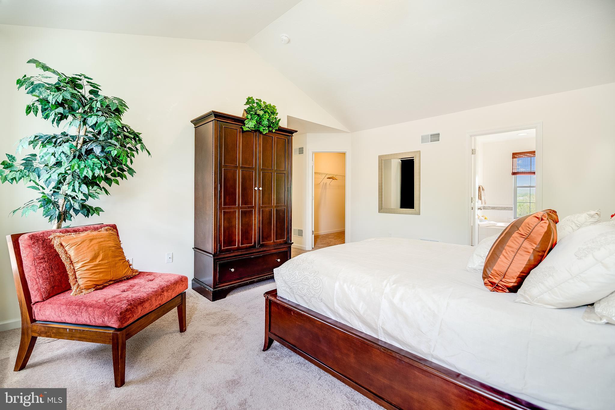 102 Piedmont Way, Unit 139 Hanover, PA 17331 - Photo 17 of 27 a bedroom with a bed and a chair