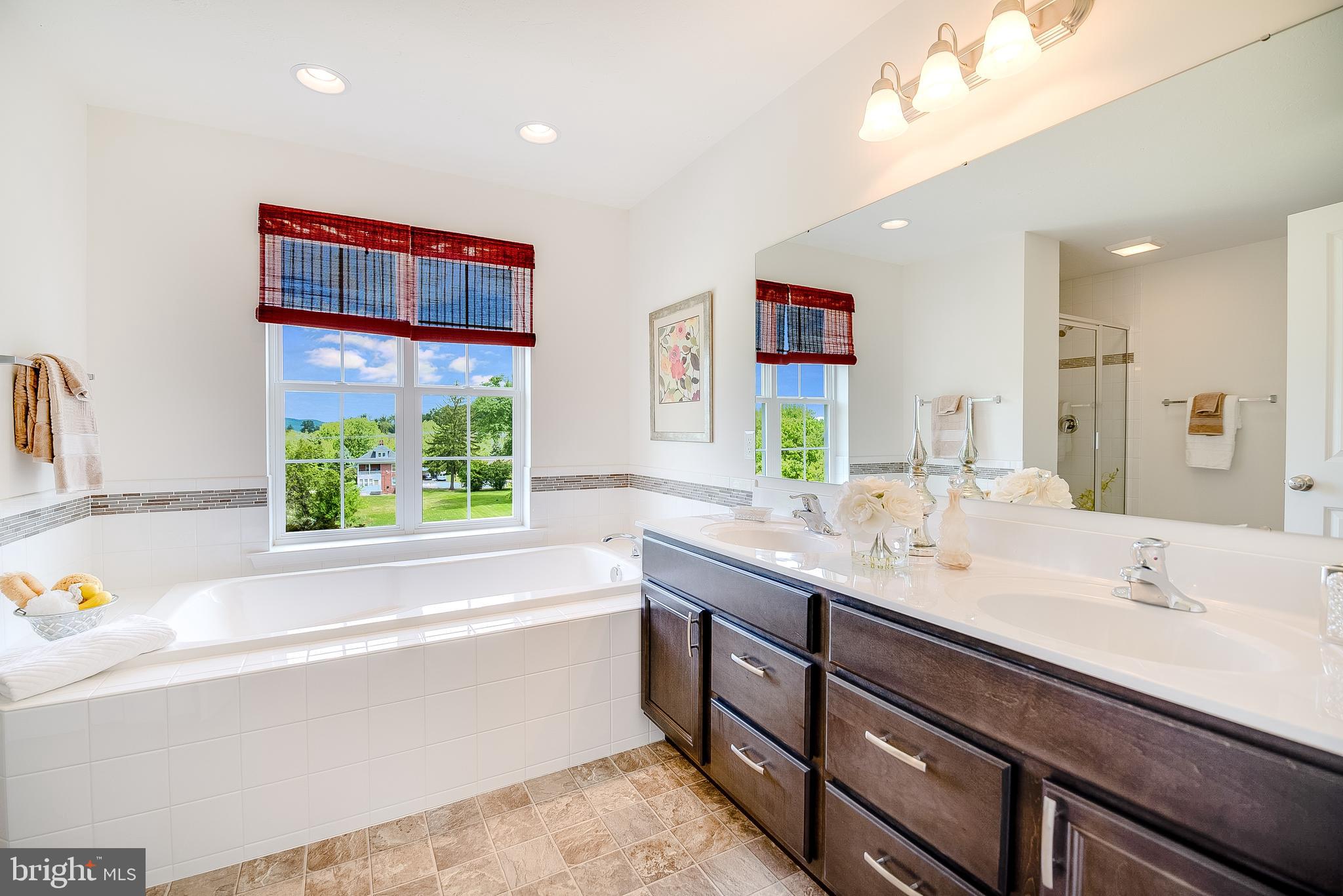 102 Piedmont Way, Unit 139 Hanover, PA 17331 - Photo 18 of 27 a bathroom with a granite countertop sink and a large mirror