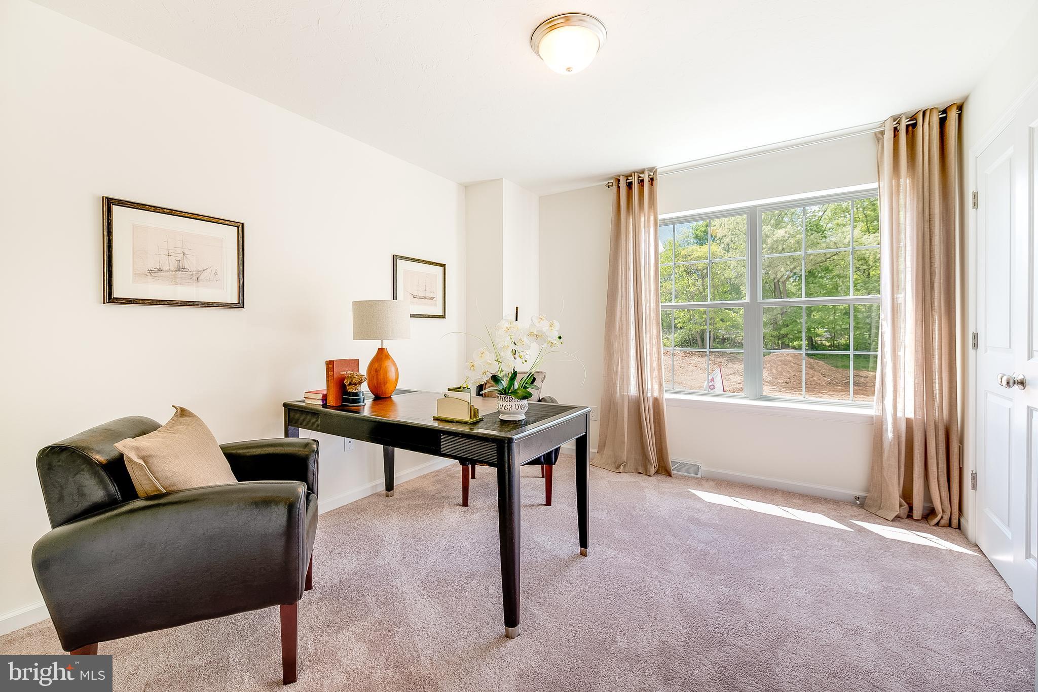102 Piedmont Way, Unit 139 Hanover, PA 17331 - Photo 20 of 27 a living room with furniture and a window