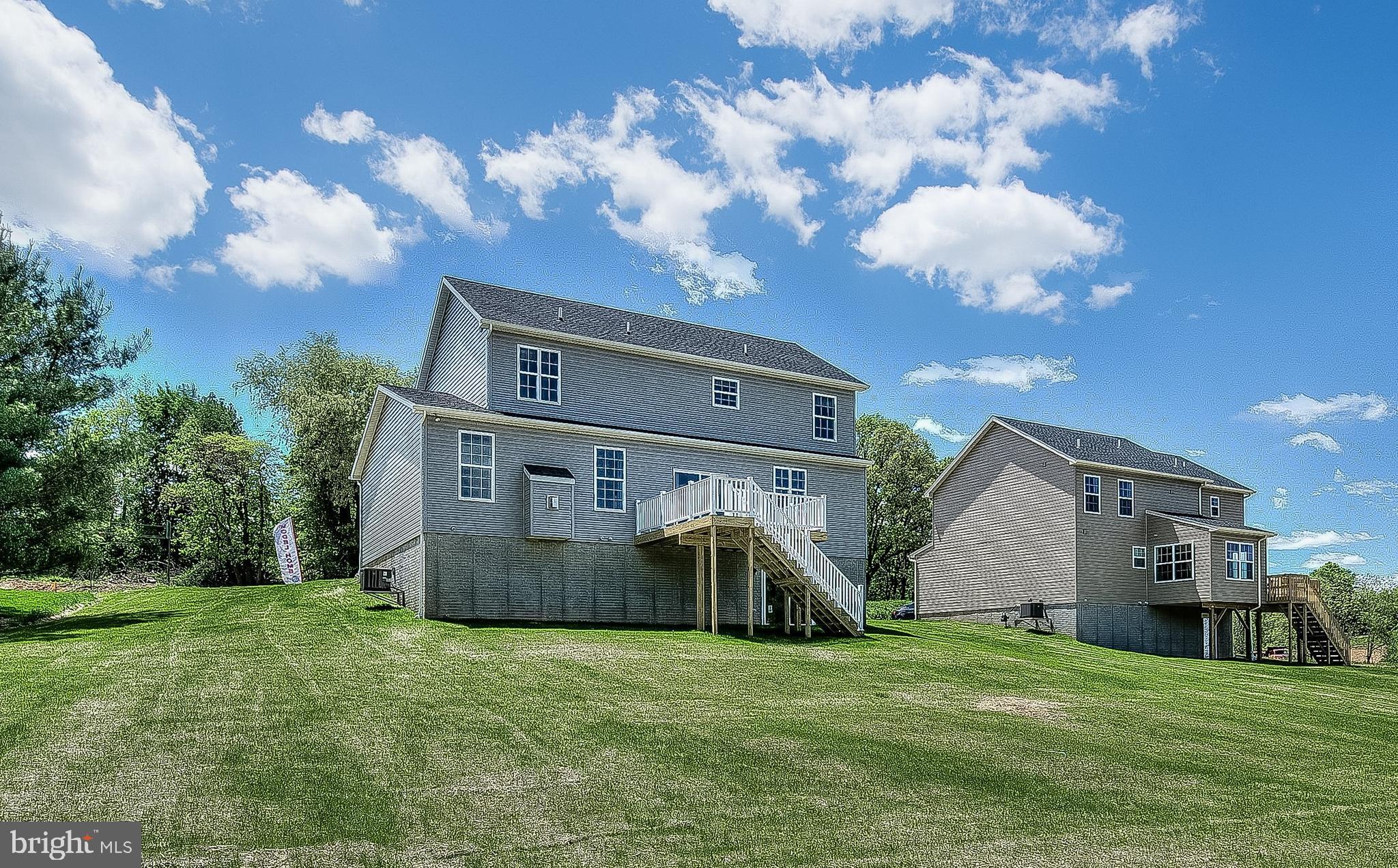 102 Piedmont Way, Unit 139 Hanover, PA 17331 - Photo 25 of 27 a front view of a house with garden
