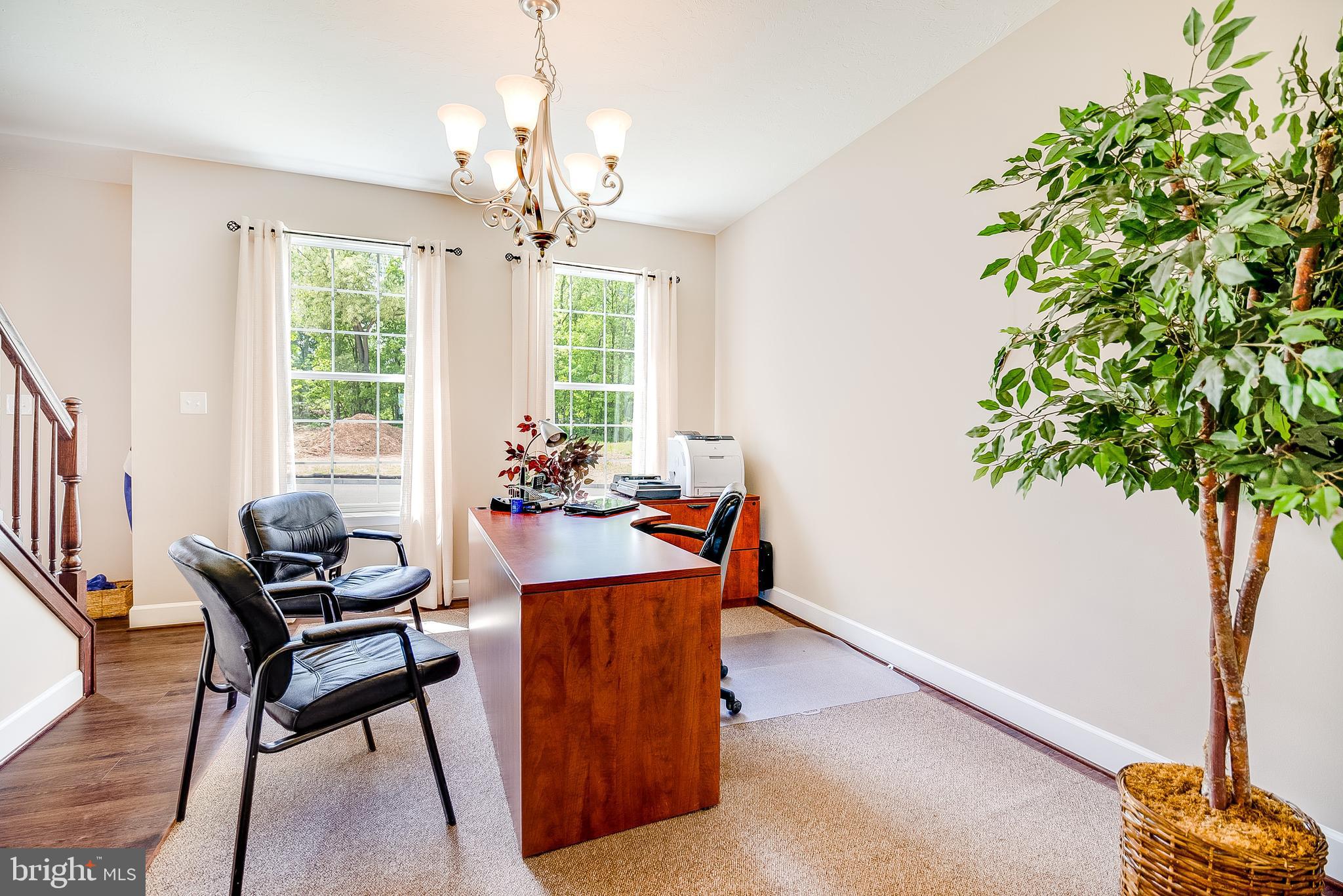102 Piedmont Way, Unit 139 Hanover, PA 17331 - Photo 6 of 27 a living room with furniture and a potted plant
