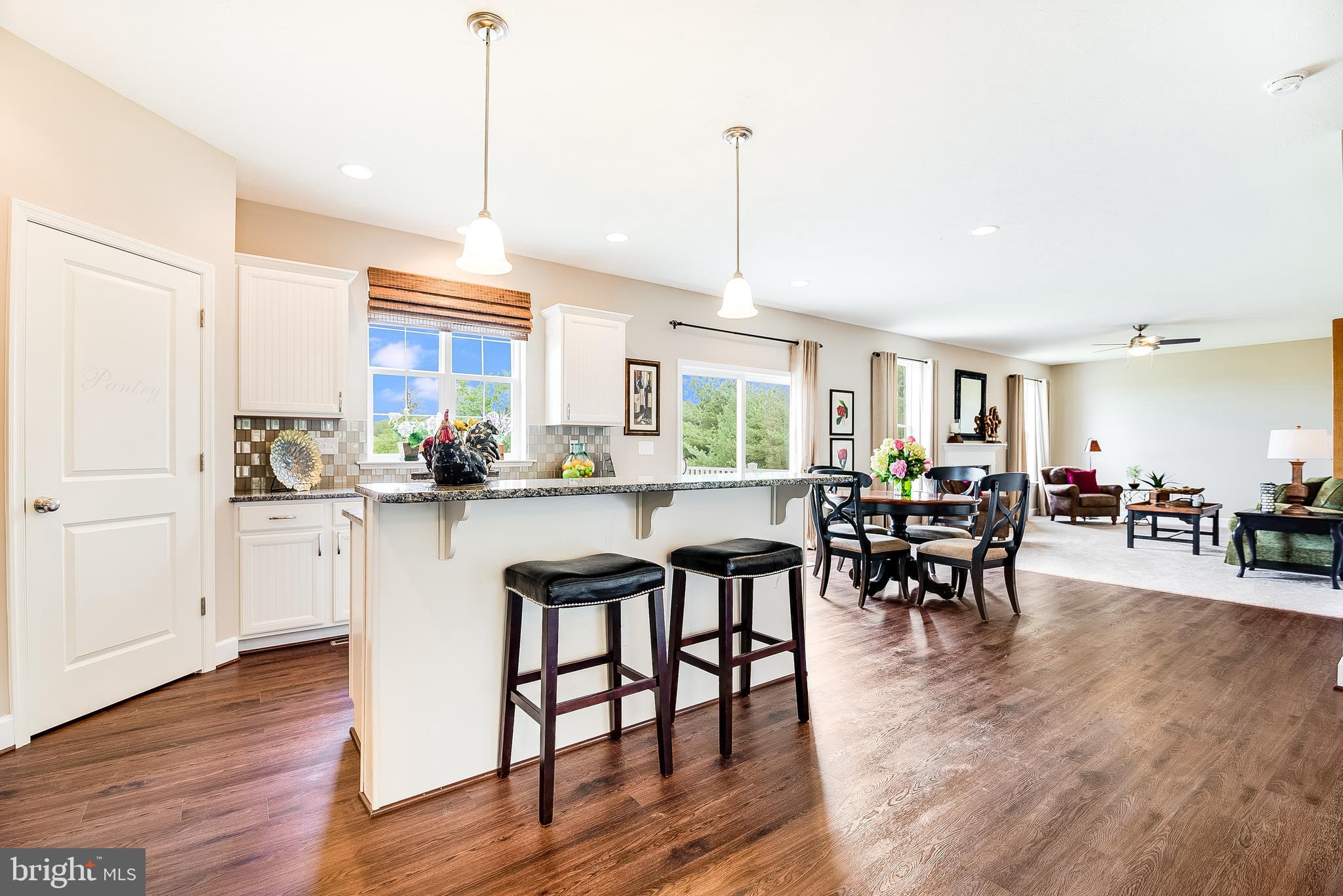 102 Piedmont Way, Unit 139 Hanover, PA 17331 - Photo 9 of 27 a kitchen with lots of counter and chairs