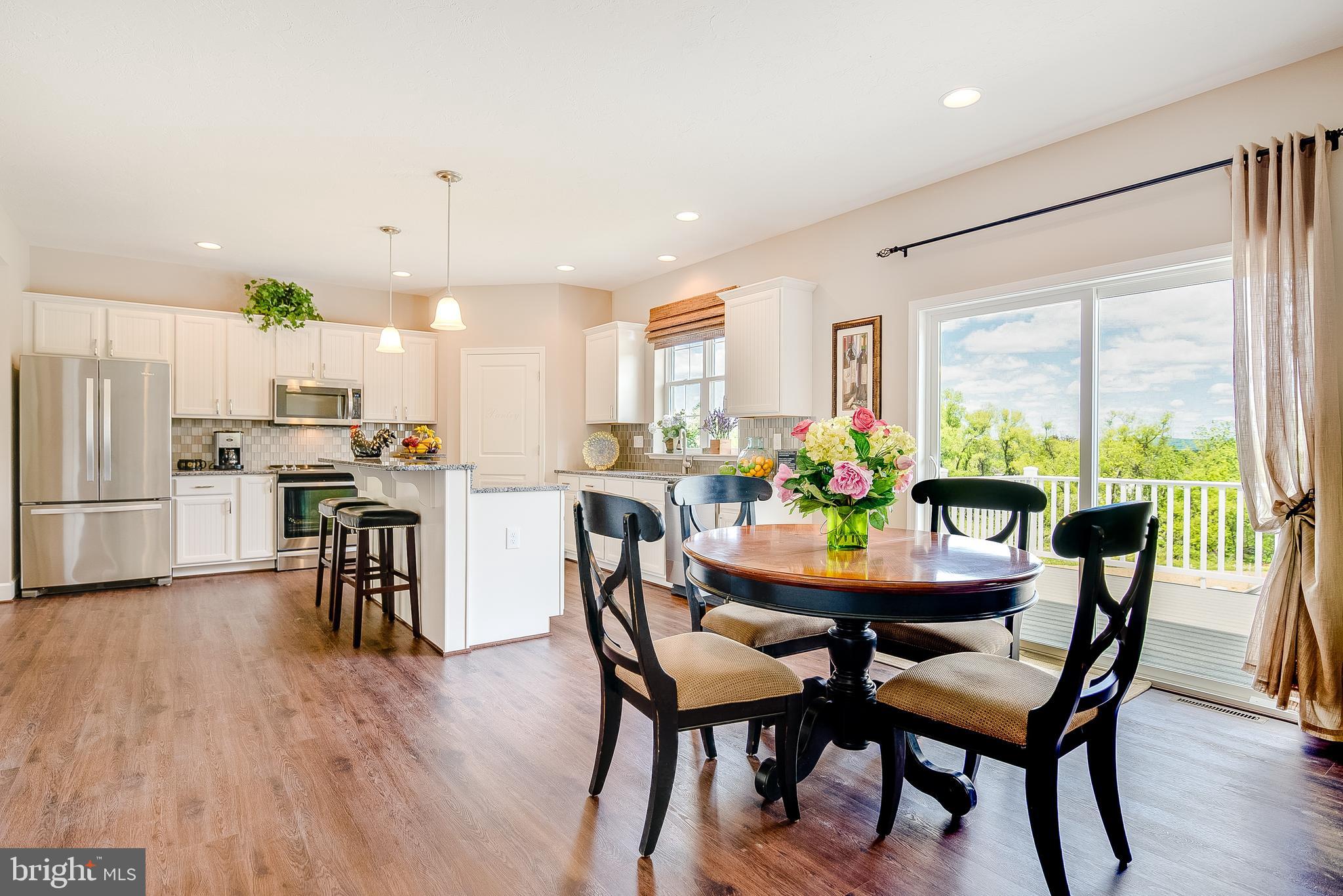 102 Piedmont Way, Unit 139 Hanover, PA 17331 - Photo 10 of 27 a dining room with furniture and wooden floor