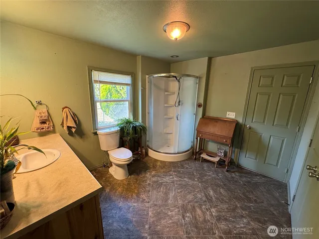 a room with chairs closet and a window