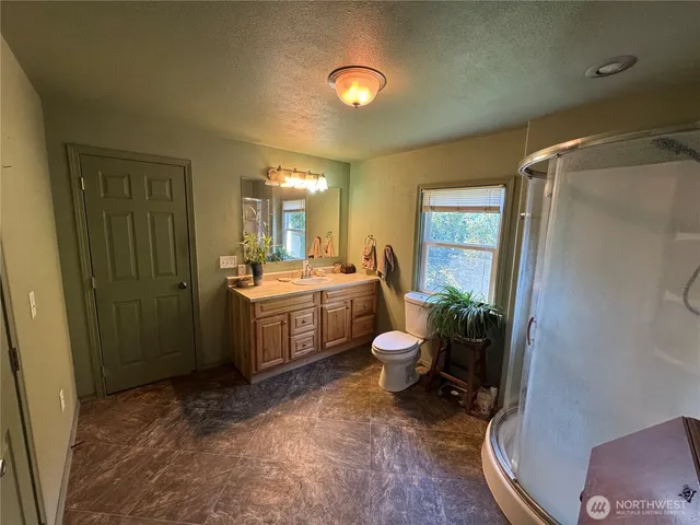 a room with a sink and a mirror