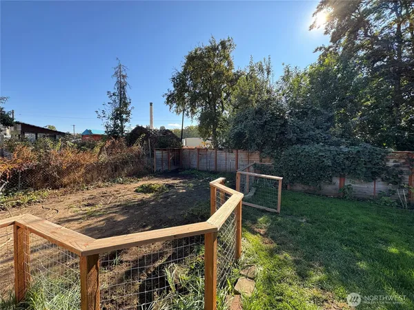 a view of a backyard with sitting area