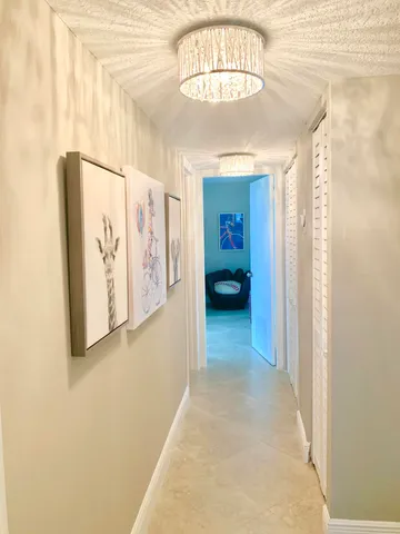 a view of room with furniture and large window