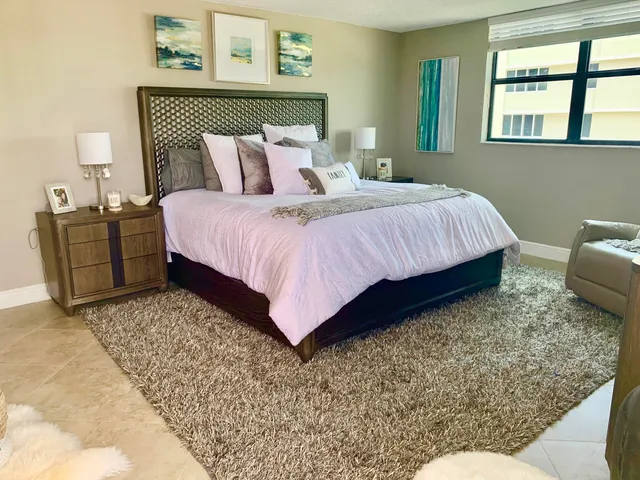 a view of a room with a floor to ceiling window