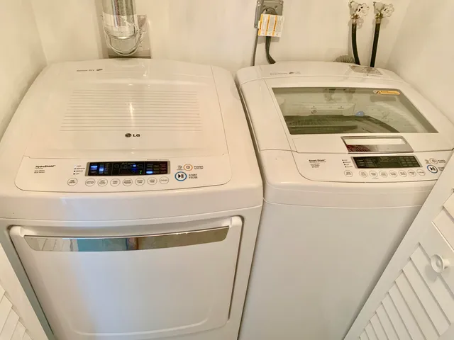 a view of swimming pool with outdoor seating and plants
