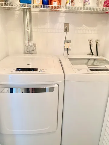 a view of building with yard and staircase