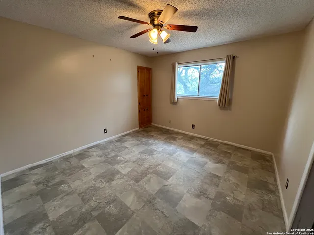a kitchen with a stove and a refrigerator