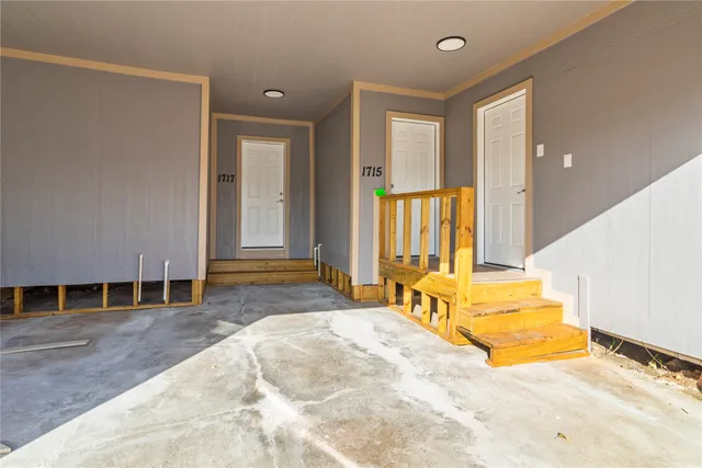 a spacious bedroom with a bed and a window